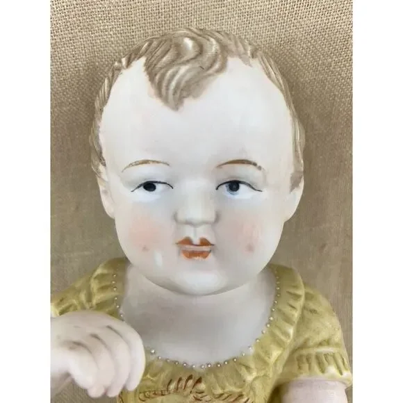 Vintage Bisque Porcelain Piano Baby Figurine 7”